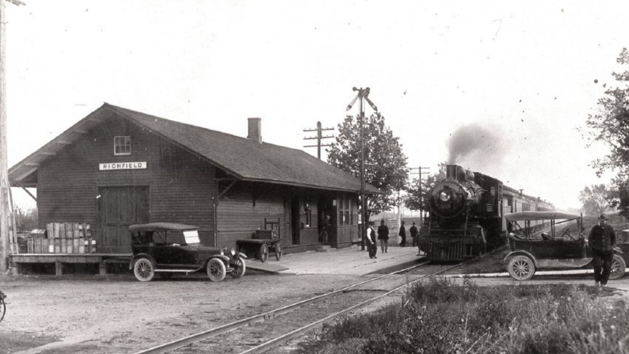 A Milwaukee Road passenger train approaching the depot at Richfield, Wisconsin in 1915