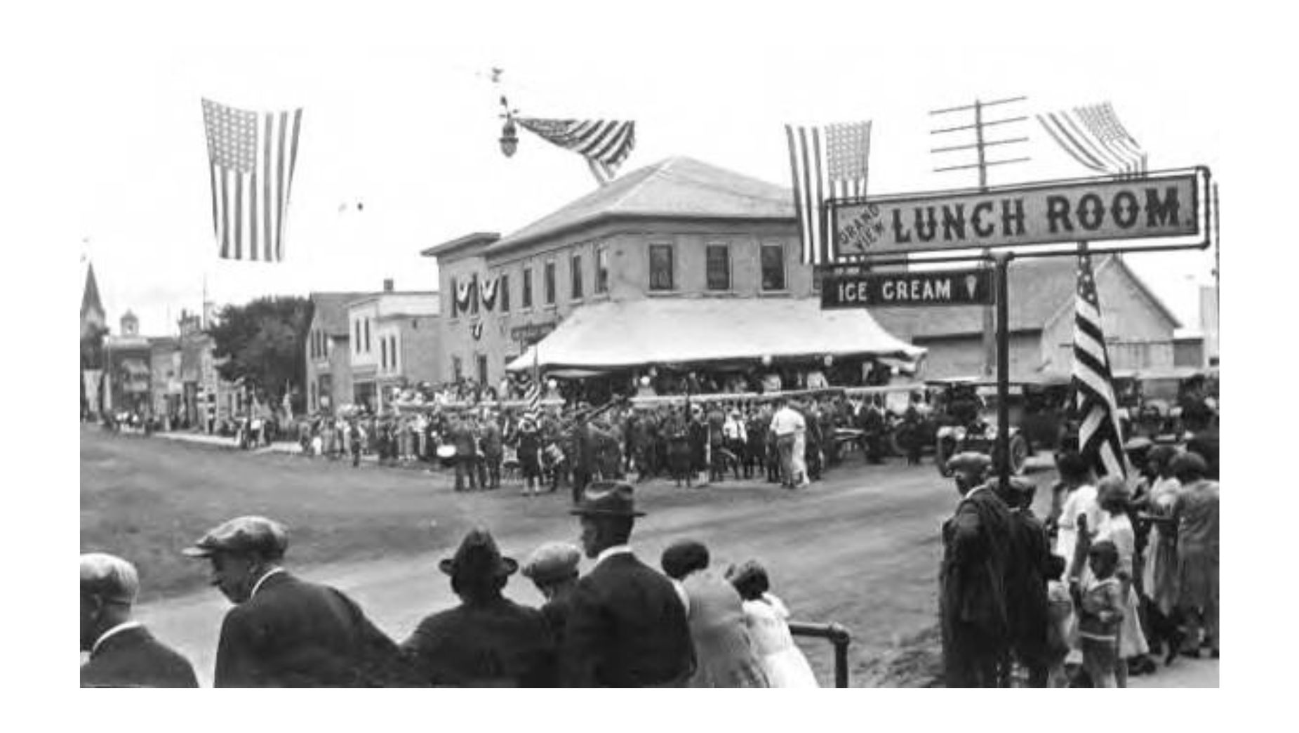 The American flag at the parade on Kewaskum’s Main Street in Early Washington County, Wisconsin
