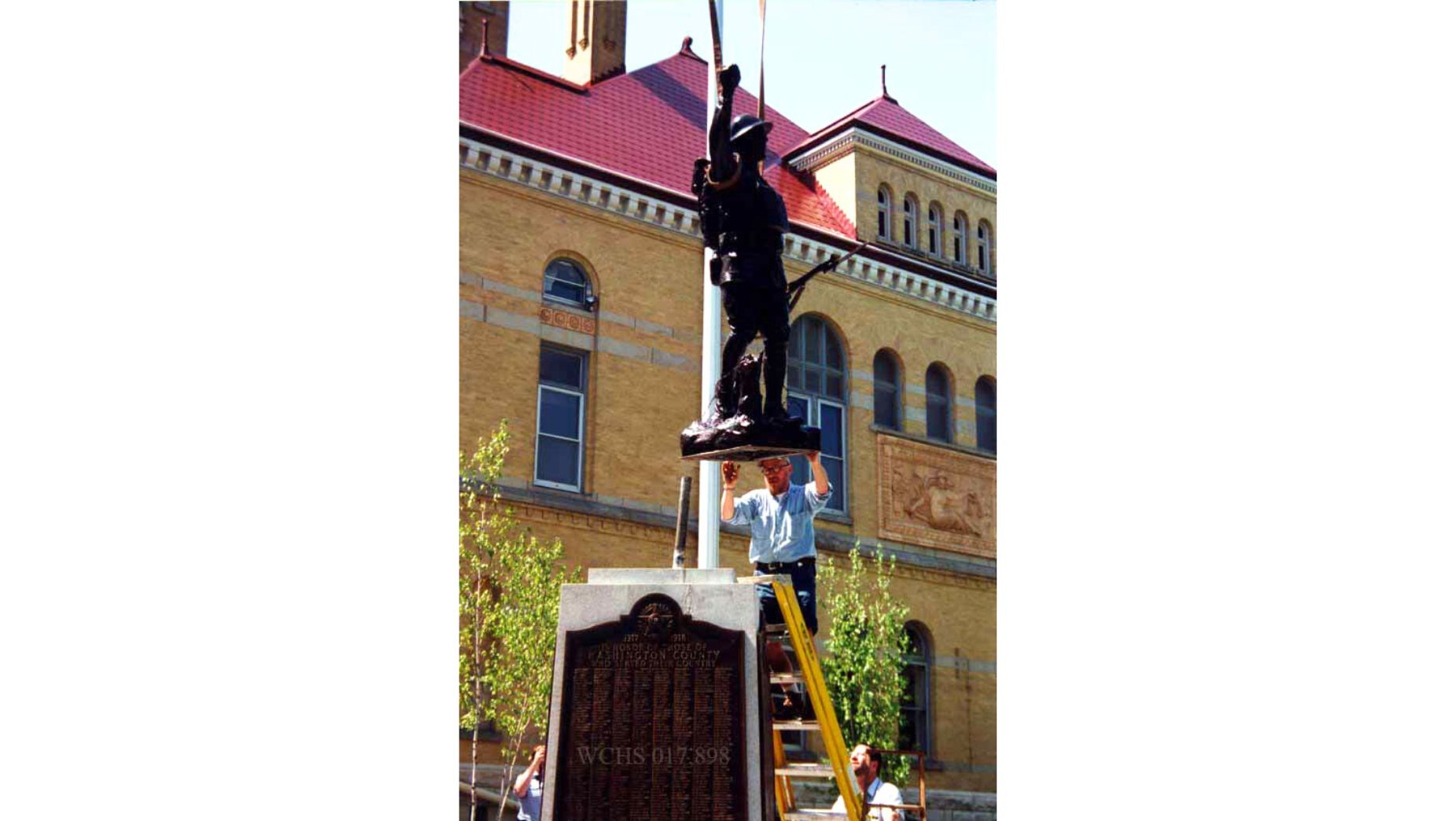 The Spirit of the American Doughboy after restoration in 2000 with The Tower Heritage Center in Washington County, Wisconsin