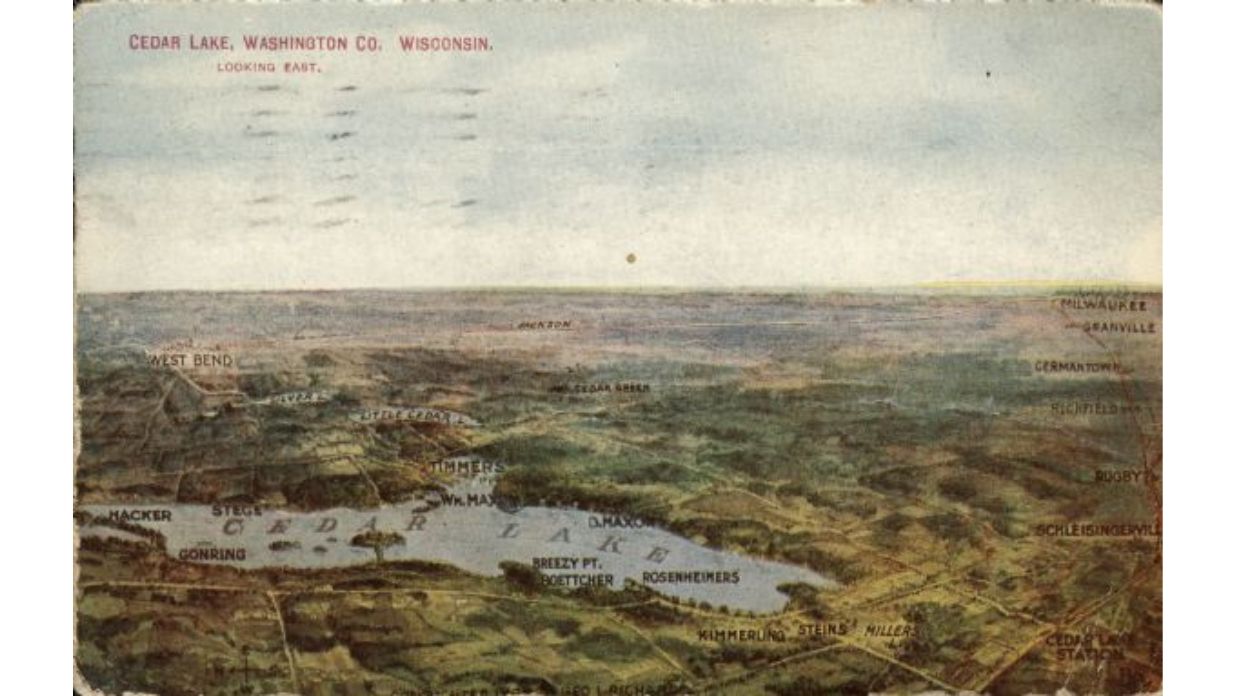 An aerial view of Cedar Lake with The Tower Heritage Center home to the Washington County Historical Society in West Bend, Wisconsin
