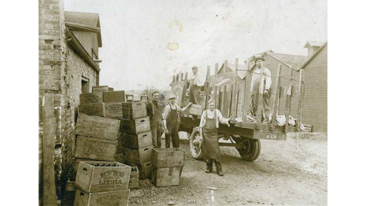 Workers outside of the brewery in Washington County with The Tower Heritage Center