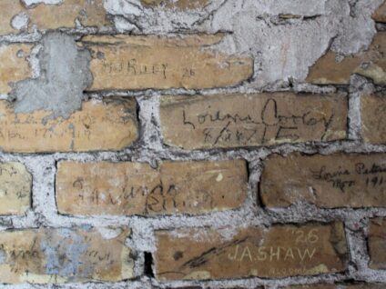 Graffiti on bricks walls in the tower of the 1889 Courthouse of The Tower Heritage Center in West Bend, Wisconsin