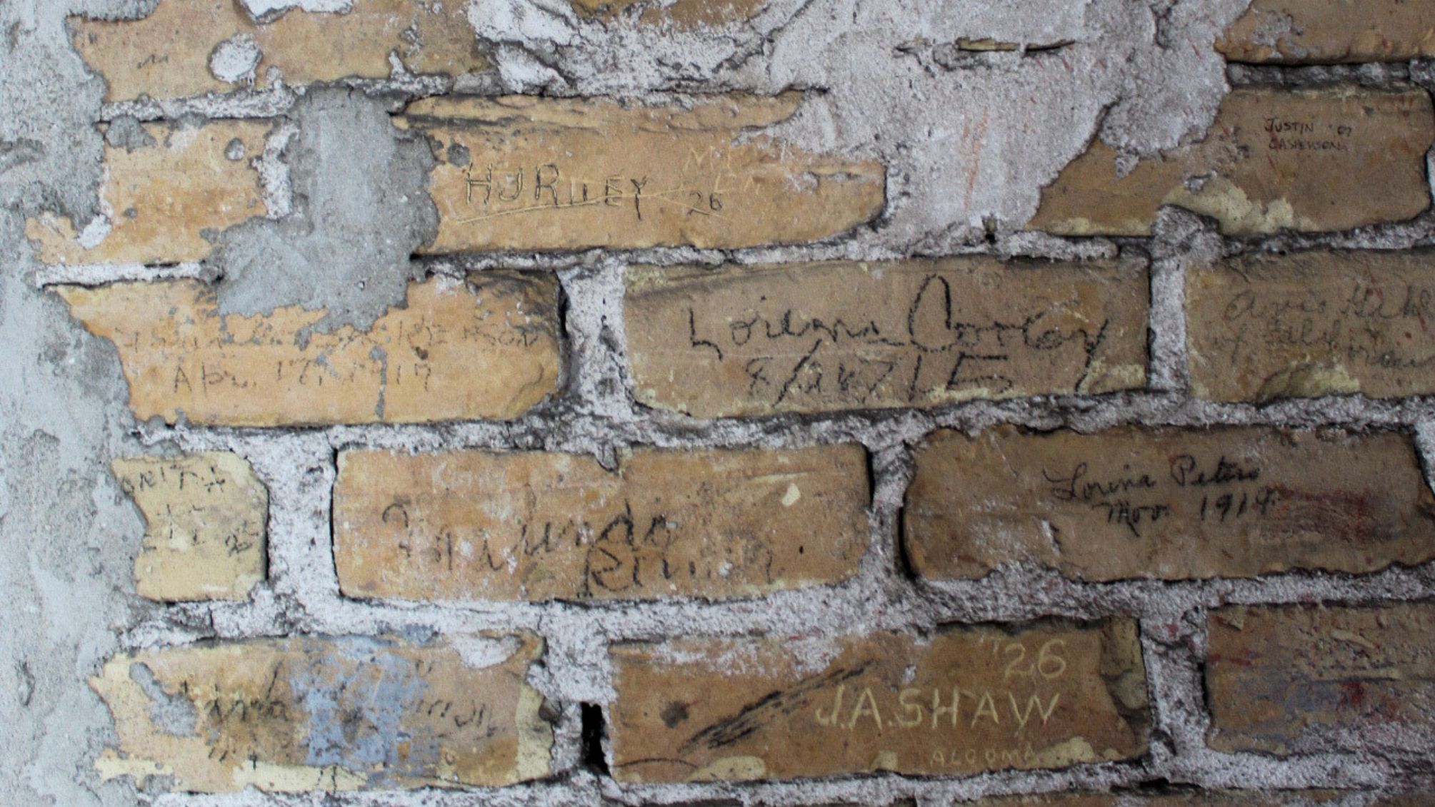 Graffiti on bricks walls in the tower of the 1889 Courthouse of The Tower Heritage Center in West Bend, Wisconsin