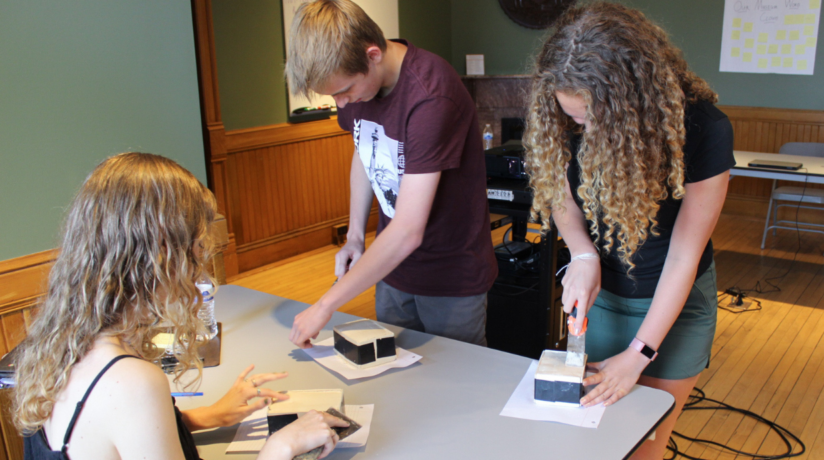 Teen Leaders making bricks