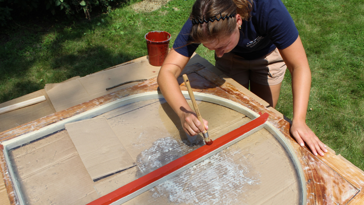 Applying linseed oil paint to wood sash windows